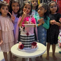 A magic themed birthday party isn't complete without a magical cake moment. Here are the birthday girl and her friends, wands and cards in hand, ready to celebrate. I love adding that extra bit of sparkle to make their special day unforgettable.