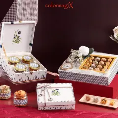 A duplicate of image 2, this elegant white and blue floral themed Diwali hamper set is perfect for sophisticated festive gifting.