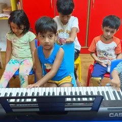 More scenes from our music summer camp. The kids are learning together, sharing the instrument, and discovering the joy of making music as a team.