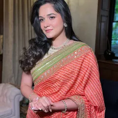 A beautiful look in a traditional Bandhani saree. The makeup is soft and natural, perfect for a daytime event.
