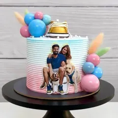 Another angle of the adorable parents-to-be cake, showing the pastel ombre frosting and cute sneaker topper.