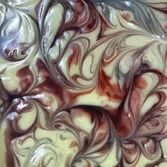 The magic of natural colorants. This is the batter for my Lush Lavender soap, colored with Alkanet Root, which creates these beautiful, deep purple and reddish swirls.