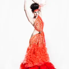 This look is one of my proudest creative achievements. Inspired by a flamingo, I draped unstitched fabric from Vandana Fabrics to create this entire gown without a single cut or stitch, showing how fabric itself can become high fashion.