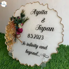 A romantic keepsake for a couple, this frame includes their names, a special date, and a meaningful quote. A bouquet of preserved flowers adds a beautiful 3D element.