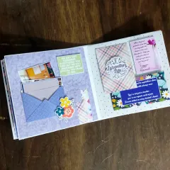 This page features multiple envelopes and pockets for students to tuck in their personal farewell notes.