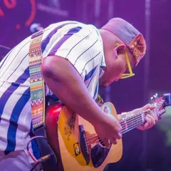 Caught in the act. A side profile shot of me completely focused on my guitar during a live performance.