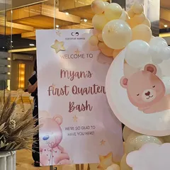 The personalized welcome sign for the celestial-themed party, decorated with matching graphics and a small balloon arrangement.