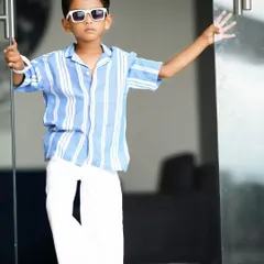 This cool little guy is turning five! A fun and stylish birthday shoot capturing his confident personality with sunglasses and a great pose.