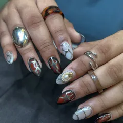 This set is a masterpiece of mixed media art, featuring abstract patterns, metallic accents, and 3D pearl details. It's a bold, artistic look for someone who isn't afraid to stand out.