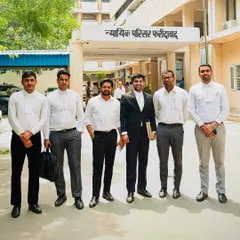 My team and I outside the Nyayik Parisar in Faridabad after a productive day. We successfully secured bail for a client facing charges under IPC 420 and 120, a testament to our collaborative efforts.