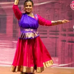 A Kathak performer in a vibrant costume, showcasing the grace and poise taught in our classes. We emphasize correct posture and fluid movements from the very beginning of the training.
