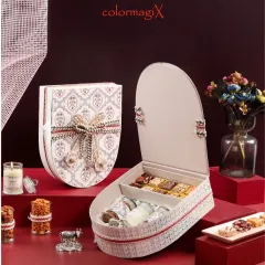 The shield box opens to reveal a well-organized interior with compartments for sweets and jars, showing that our designs are as functional as they are beautiful.