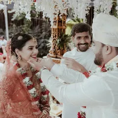 A tender moment during the wedding rituals, where the groom gently touches the bride's cheek. It’s these small, intimate gestures that tell the biggest stories of love.