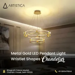 This metal gold LED pendant light features interlocking wristlet shapes, offering a modern and artistic statement. It provides a warm, ambient glow, perfect for suspension over a dining table or in a chic living area.