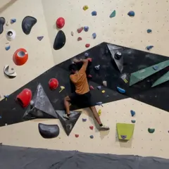 Here’s a climber getting focused on one of our routes. With a mix of holds and wall angles, you can always find a new bouldering problem to challenge your technique and strength.