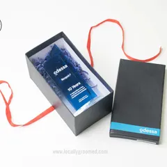 A closer view of the 10-year service award for Odessa. The gift box includes the custom acrylic trophy, showing how we present our recognition items with care.
