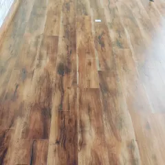 A classic wooden laminate flooring installation. This type of flooring adds warmth and value to any room and is available in many different shades and textures.