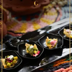 These bite-sized canapés are crafted for effortless mingling. Served in elegant black bowls, they offer a burst of flavour, making them a favourite for cocktail hours and pre-dinner gatherings.