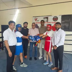 Two of my youth boxers getting final instructions from the referee before their match. Ring experience is crucial for development.