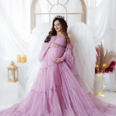 For the mama who wants a true fairytale moment. This portrait features one of my ethereal tulle gowns and majestic angel wings, creating a breathtaking and magical pregnancy photo.