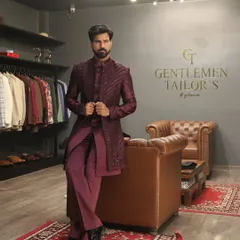This wine-colored Indo-western ensemble, featuring a sequined long jacket over a matching kurta and trousers, exemplifies our approach to modern celebratory wear. Photographed in our studio, it showcases the sharp tailoring and luxurious feel of our creations.