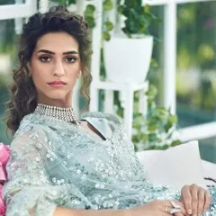 An elegant and sophisticated look for a wedding reception or engagement. The makeup features soft, defined eyes and a neutral colour palette to complement the intricate details of the light blue outfit.