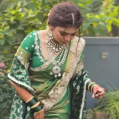 A portrait of the bride, showing the front view of her braided hairstyle. The soft twists at the front add a modern touch to the traditional braid.
