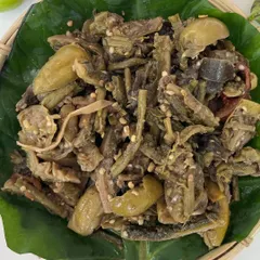 A close-up of our 'Rusep' served on a banana leaf. The mix of textures and flavors from the various wild vegetables makes this a must-try side dish to accompany your meal.