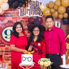 Welcome to Hogwarts! We brought the magic of Harry Potter to this 12th birthday with a complete themed setup, including a Platform 9 3/4 photo wall, house banners, and even a custom cake. The whole family got into the wizarding spirit for this memorable portrait.