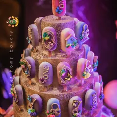 A stunning tower of enchanted-themed cakesicles for a first birthday. Each one is decorated with edible butterflies, flowers, and tiny golden frames, creating a magical and elegant display.