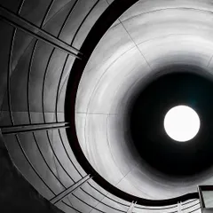 For the BCG Headquarters in Mumbai, we reimagined the corporate environment. This view looks up through a 'skylit' circular courtyard, a core element that brings light and air deep into the vertical campus, echoing the industrial past of the city.