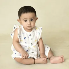 A collection of simple, classic portraits of twin babies. Without props or themes, their individual expressions and connection are beautifully highlighted.