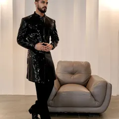 The full silhouette of our black sequin Indo-Western jacket. Paired with tailored black trousers and boots, it creates a sharp, modern, and glamorous look for any celebration.