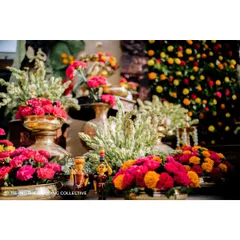 To infuse a playful vibe, we incorporated traditional Channapatna toys into the decor. These colourful wooden dolls, placed among the brassware and flowers, add a unique and charming touch that celebrates local craftsmanship.