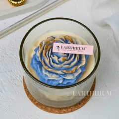 A closer look at the blue and gold peony candle. I love how the gold detailing catches the light, making it a truly special piece.