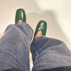 A sneak peek from my perspective, wearing a new pair of green croc-embossed leather loafers. This is part of my process, testing new designs for comfort and style before they ever reach the workshop.