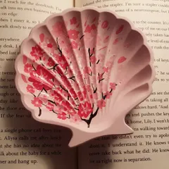We can't get enough of pink. This mini shell dish was custom ordered with a hand-painted cherry blossom design, making it a truly unique and personal piece.