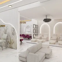 We deliver a high-end salon experience. This is a look at the quality of the interior design and layout you will receive, featuring a spacious reception, comfortable pedicure stations, and a modern aesthetic.