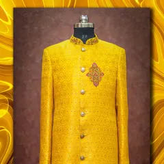 The groom's yellow brocade sherwani, designed to perfectly complement the bride's outfit for a Haldi or wedding ceremony.