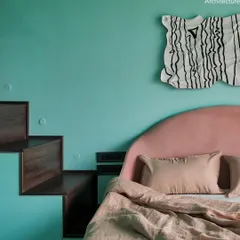 This daughter's room in Project 704 features a custom loft bed designed for sleepovers. It's large enough for six kids and has a secret storage area, plus a portable projector for movie nights.