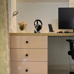 Details matter in creating a minimalist and organized study area. This close-up shows the clean lines of the desk, sleek drawers, and ample surface space, designed for focus and simplicity.