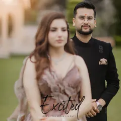 An artistic shot focusing on the groom, with his bride beautifully blurred in the foreground, creating a sense of anticipation and excitement.