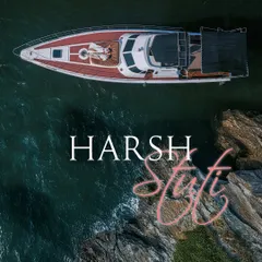 An aerial drone shot captures a couple relaxing on the bow of a yacht in the serene blue waters of Goa. This highlights my destination photography services, creating luxurious and cinematic memories wherever your story takes you.