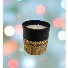 This is one of my premium glass jar candles, featuring a black frosted finish and a decorative golden lace wrap. It's designed to be a beautiful decor item that adds a touch of elegance.