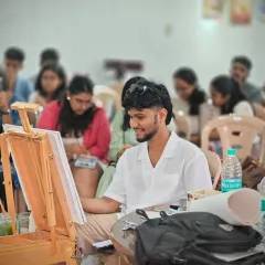 Here I am during the live demo, focused on the canvas. I believe in teaching by showing, walking the audience through each step of my process, from the initial wash to the final details.