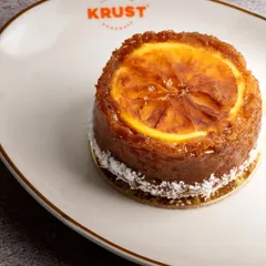 My scrumptious Ginger Tea Cake, a perfect companion for your afternoon tea. This moist, flavourful travel cake is topped with a caramelized ginger slice and coated with shredded coconut for extra texture.