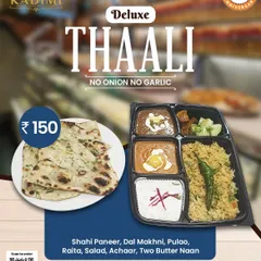 A closer look at our Deluxe Thali, featuring Shahi Paneer, Dal Makhni, Pulao, Raita, Salad, Achaar, and two Butter Naans. A complete meal for any function.