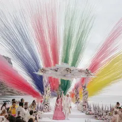 A spectacular moment of celebration as Roopali and Milap complete their pheras. The explosion of color against the serene beach backdrop in Ibiza captures the sheer joy and grandeur of a destination wedding, a story we love to tell through our lenses.