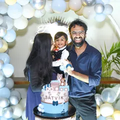 A happy family of three poses with their son's birthday cake. We make sure to get classic family portraits that you will cherish for years to come.