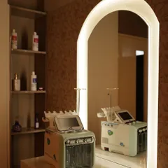 A look at one of our skincare stations, featuring a multi-function skin treatment machine reflected in the mirror. The studio is fully equipped with the tools needed to support every aspect of your beauty education.